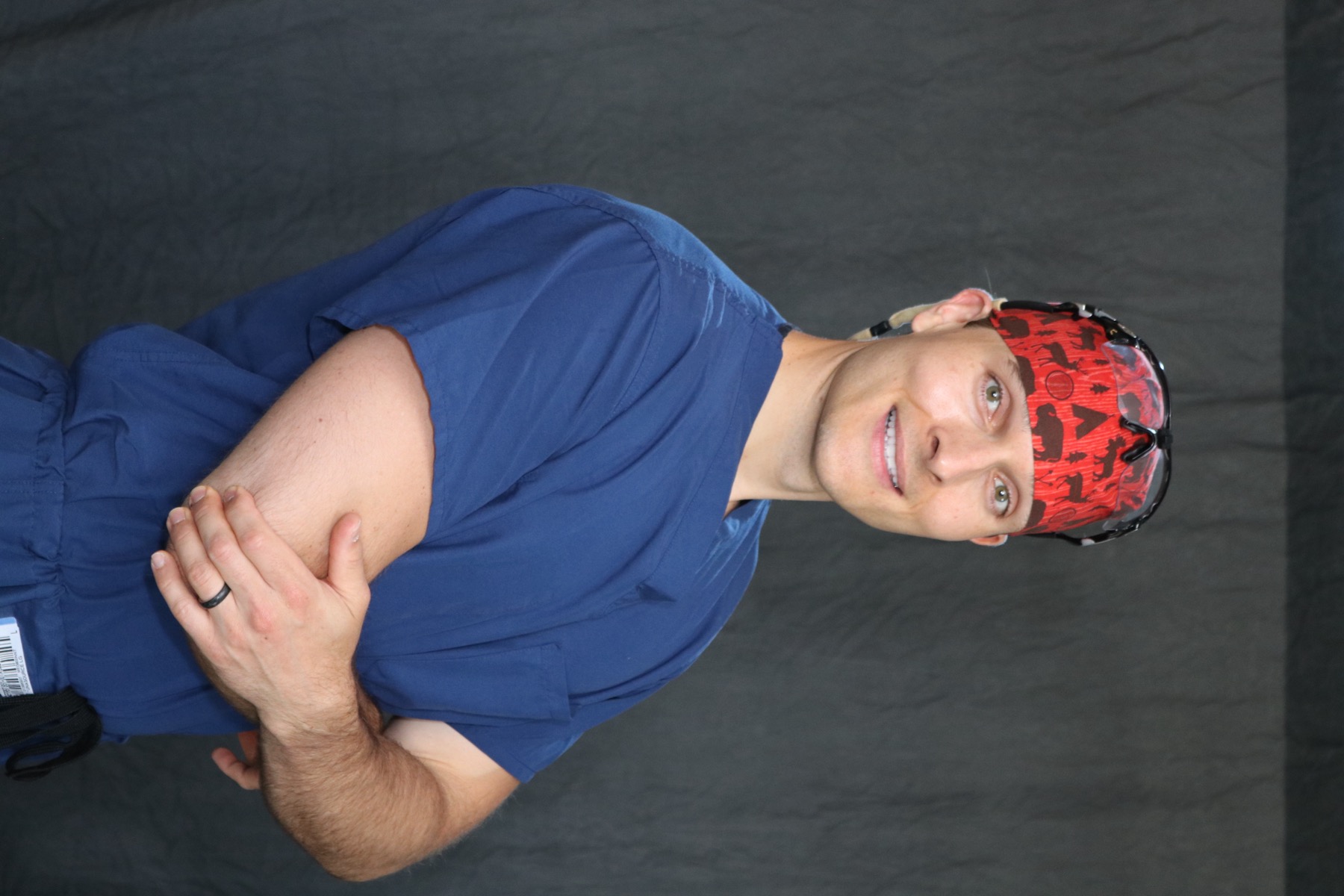 Dr. Justin T. Smith, MD, in surgical scrubs